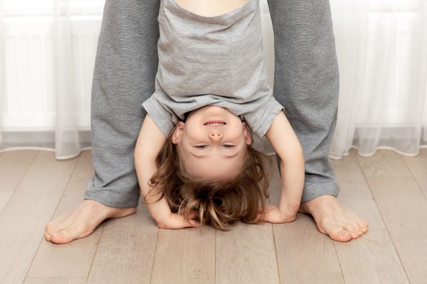 dad-holds-upside-down-fun-smiling-adorable-child-2024-11-28-10-40-39-utc - SKIDamarink KIDs calm child naturally