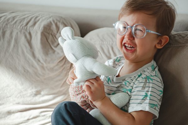 Child with autism hugs a toy cries and gets angry - SKIDamarink KIDs Child with autism hugs a toy, cries and gets angry