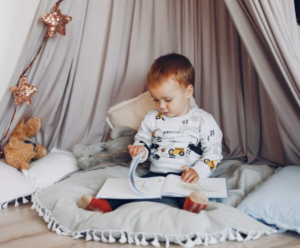 little boy in calming corner, how to help a child with sensory overload, sensory overload symptoms in children, sensory meltdown, preventing sensory overload in children