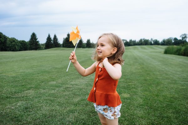 Cute Toddler Girl Holding a Pinwheel