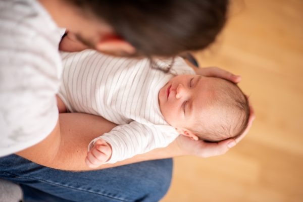 Father Gently Cradling Newborn in Arms - SKIDamarink KIDs Father Gently Cradling Newborn in Arms