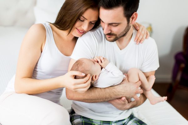 Happy family with newborn baby - SKIDamarink KIDs Happy family with newborn baby