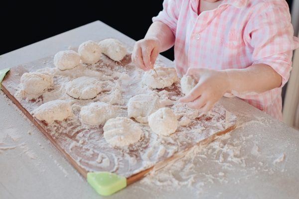 Little lovely kid helping parent with dough at kitchen - SKIDamarink KIDs Little lovely kid helping parent with dough at kitchen for everyday self regulation activities