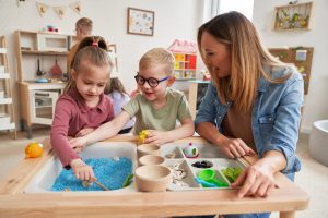 Physiotherapist doing sensory exercises with children