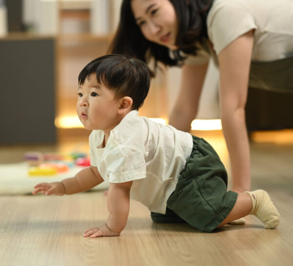 Baby boy learning to crawl, developmental play guide, how to choose toys for child, development, child development activities by age